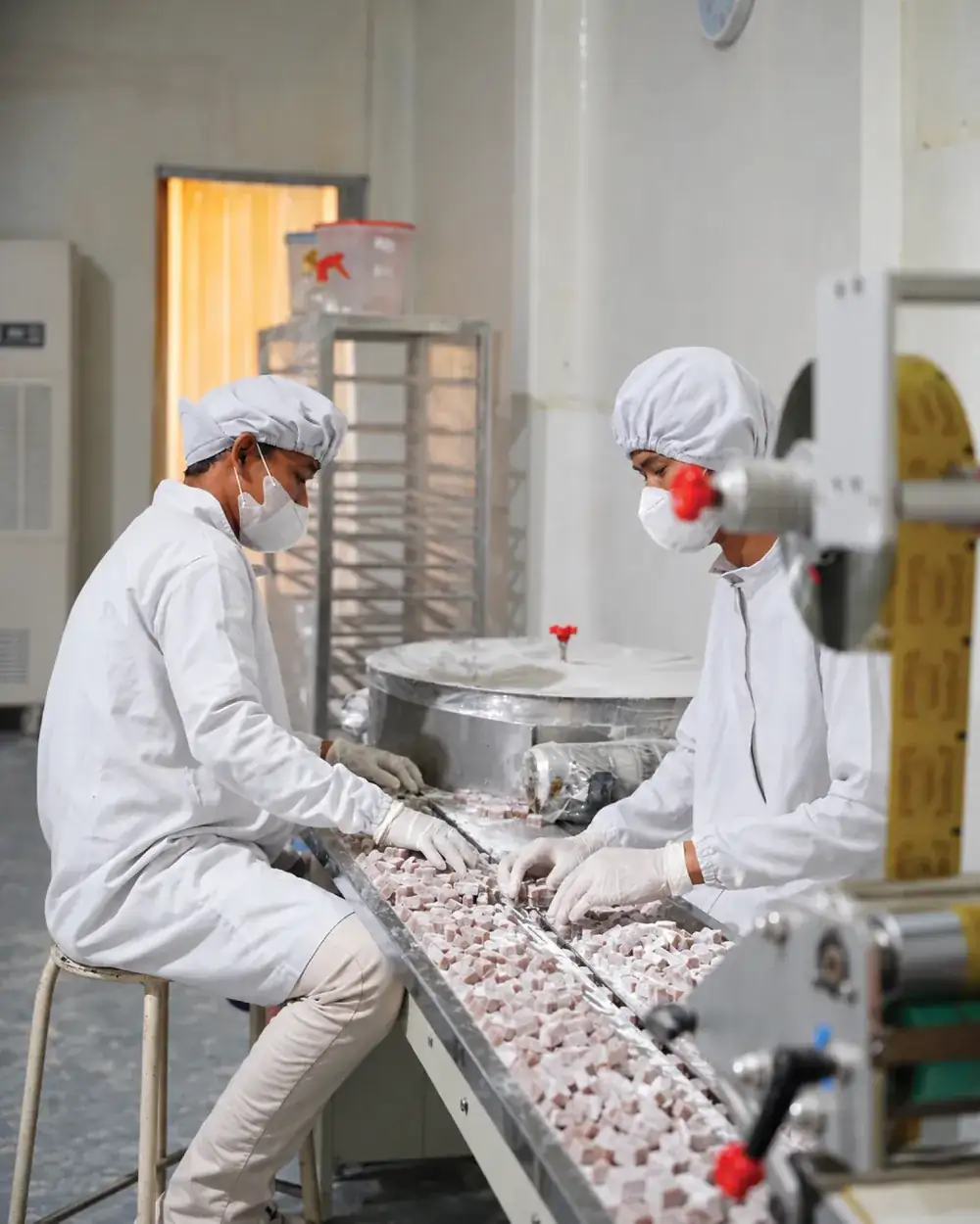 Chewy Factory team members working on the chewy candy line